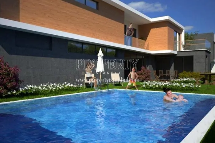 A family enjoying the compound pool in Unique Kurtkoy