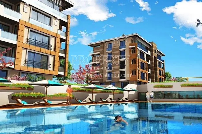 The residents of Vadi Park Konaklari swimming in the compound pool