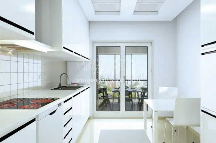 White kitchen with balcony in Vaditepe Bahcesehir