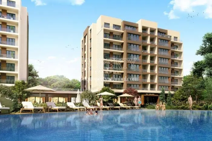 The people swimming in the Vira Istanbul compound pool