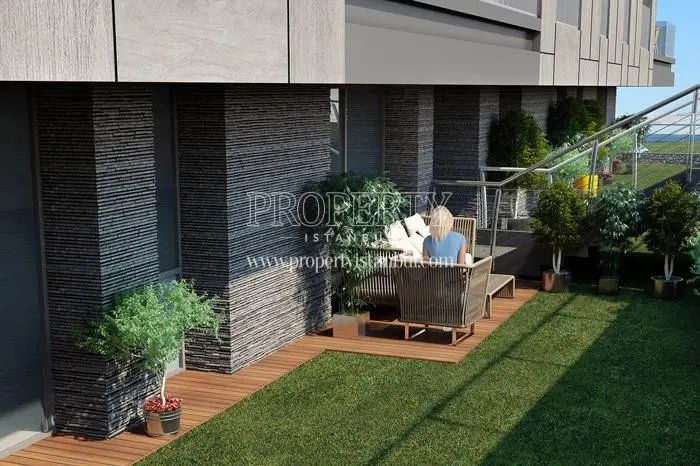 The woman reading a book in the Vue Mer Daca compound garden