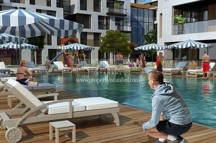 West Side Istanbul residents swimming in the compound pool