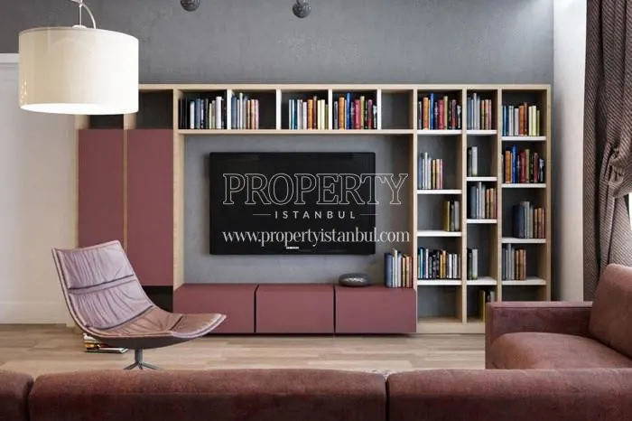 The pink corner sofa with a big bookcase in one of the Winlife Istanbul Residence apartments