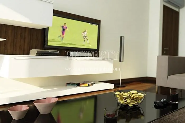 The soccer game playing on TV in one of the living rooms in Yali Atakoy