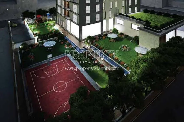 Basketball court and verdant gardens in the Yeni Yasam Evleri compound