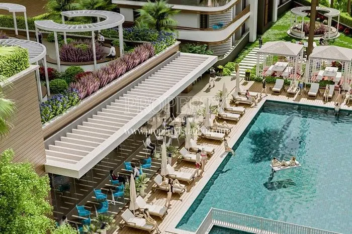 Zer Kartal residents swimming in the compound pool