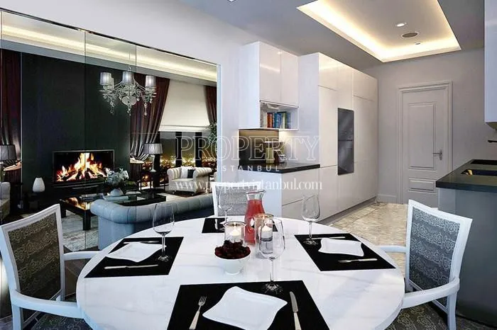 The kitchen and living room separated by a sliding glass wall in Ziverbey 34