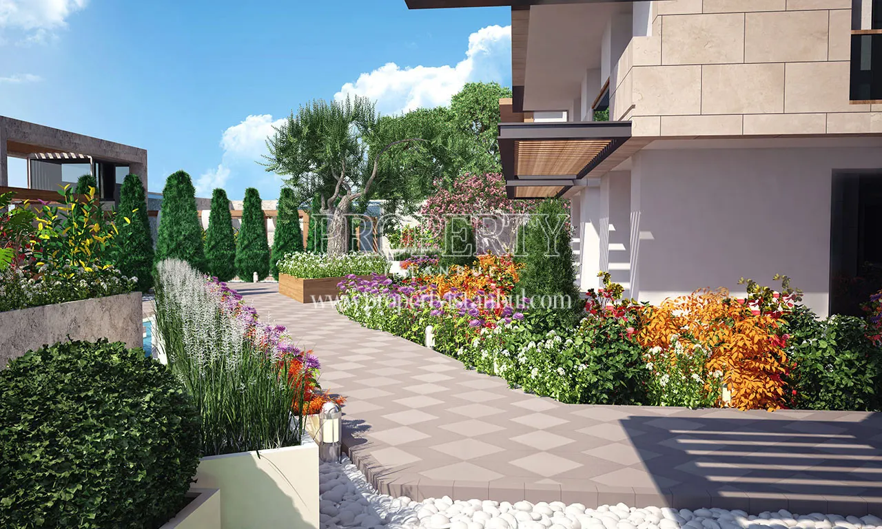 The walking track of Alya Trio surrounded by flowers