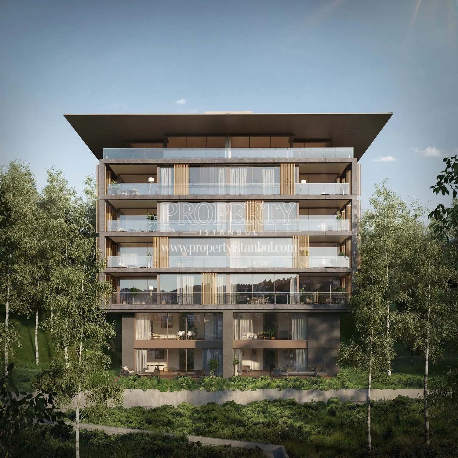 One of the buildings of the Nef Kandilli project among the trees