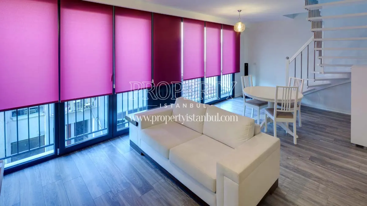 The living room of a duplex unit in Mika Studios