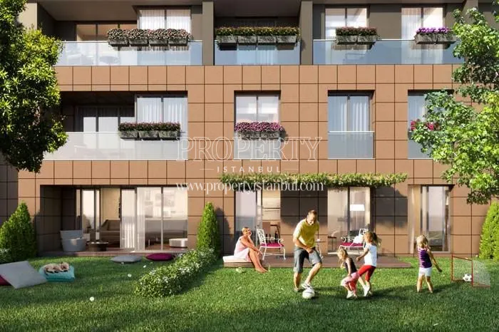The residents are playing football in the Sinpas Liva Turkuaz garden