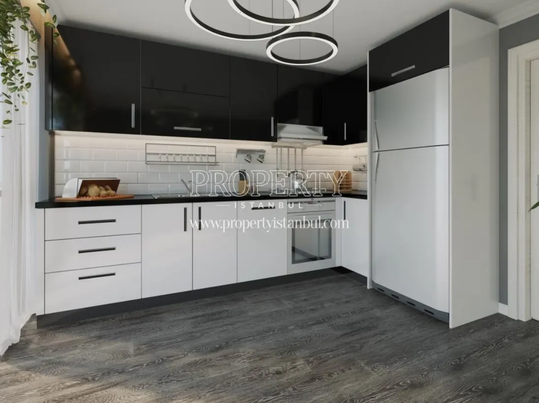 The kitchen with black and white kitchen cabinets