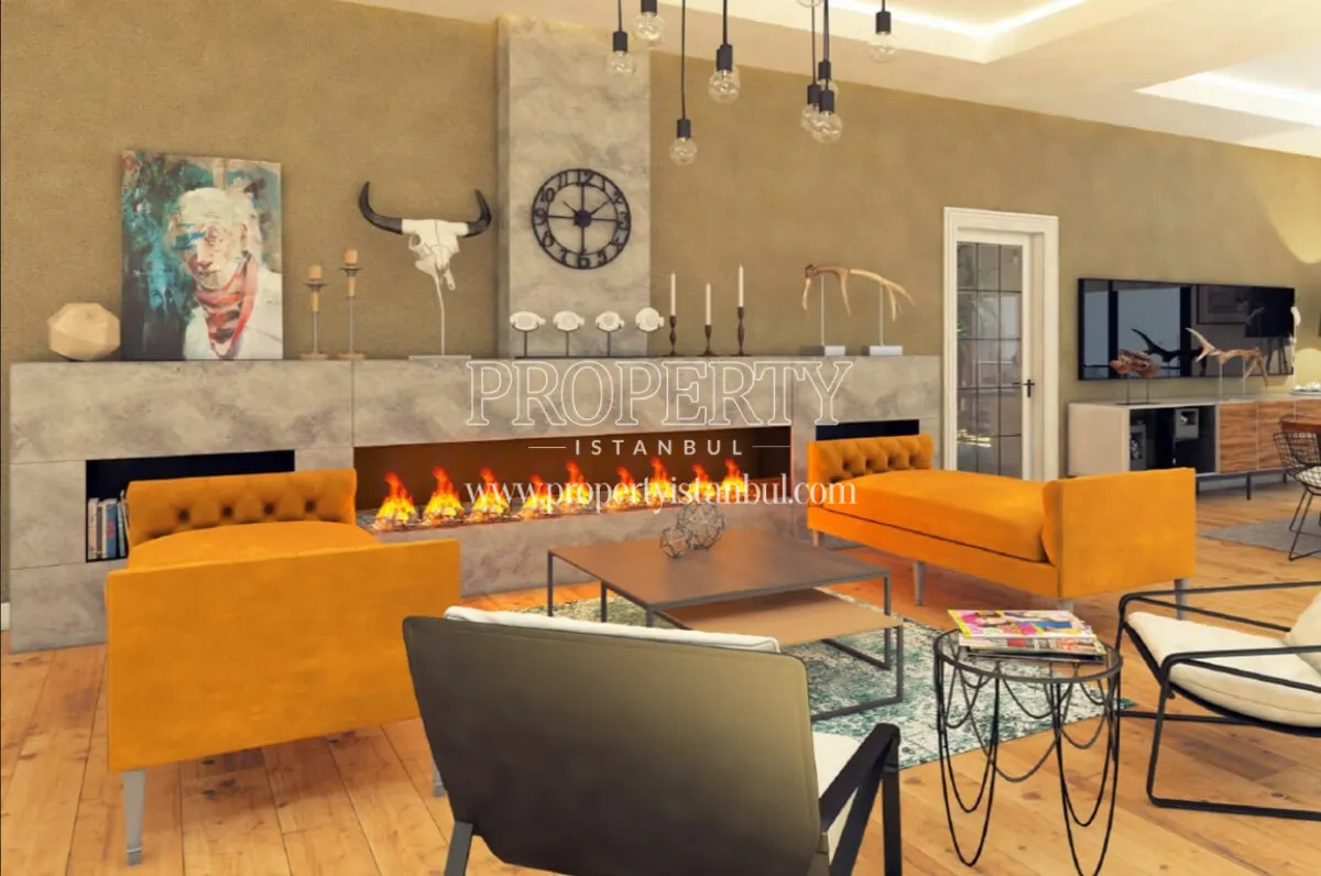 The living room with a large fireplace in Maanaa 30
