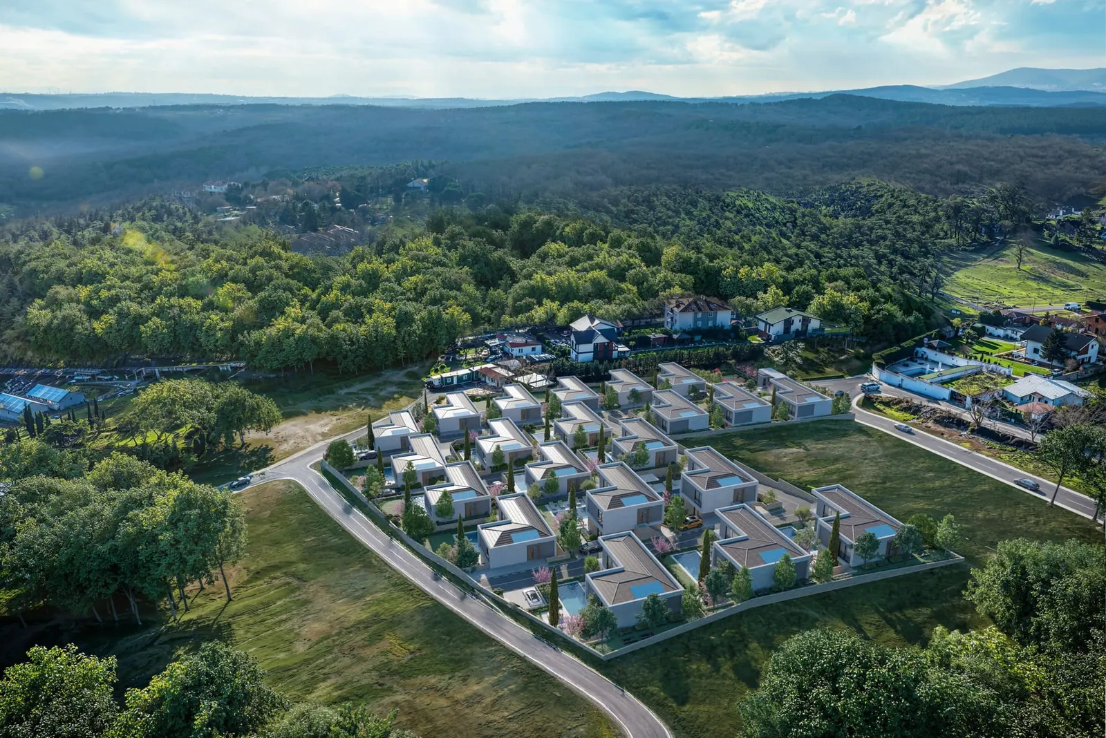 Ballica Panorama villas from above, with the woods behind