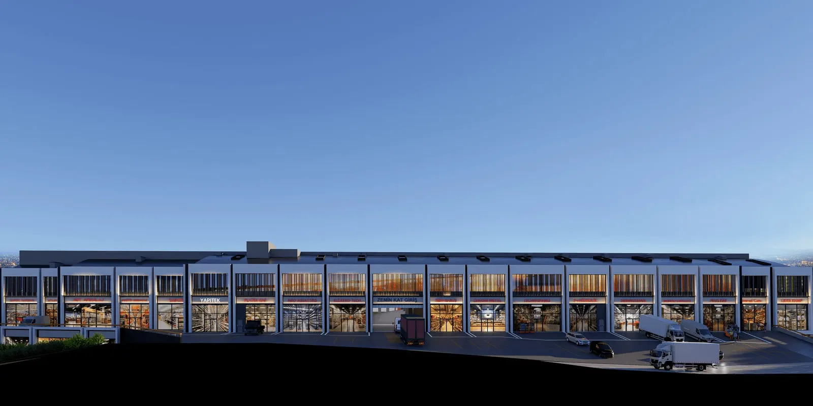 Ground-floor unit fronts of Basaksehir Ticarethane at dusk