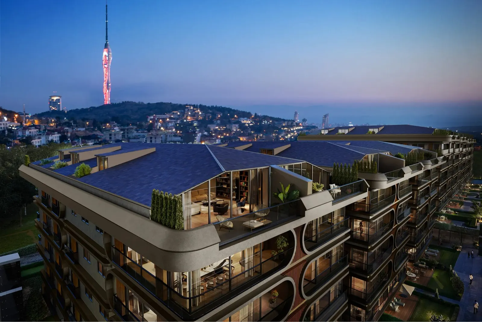 Roof duplex terraces at Bogaz Camlica at dusk, with Camlica Tower behind