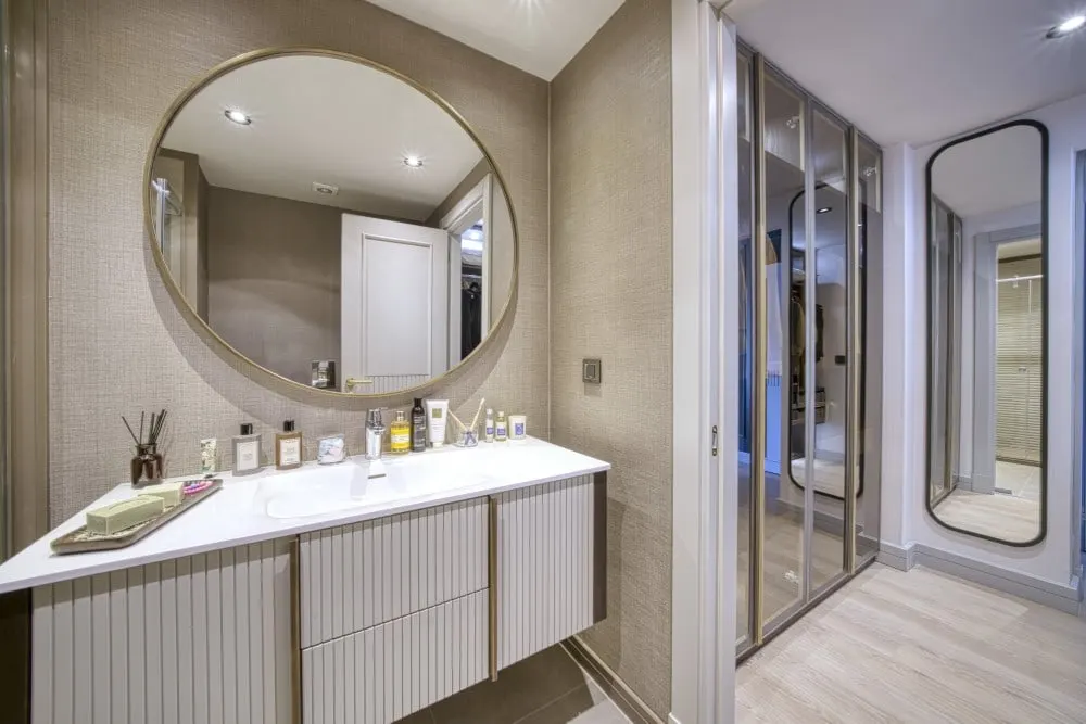 Dressing area with a round mirror in the Deniz Istanbul Sedef Konaklari show apartment