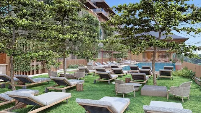 Sun loungers on the lawn by the pool at Denizkoru Sariyer