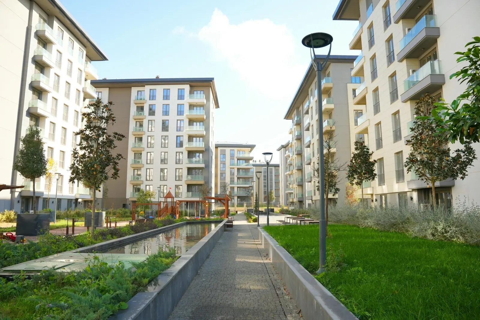 Water channel and walkway between the Emlak Konut Cinarkoy Evleri blocks