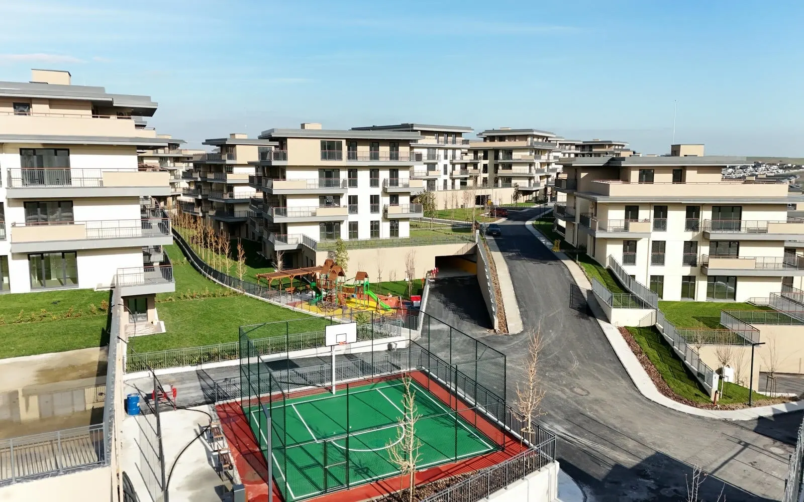 Sports court between the blocks at Emlak Konut Vadi Evleri 2. Etap