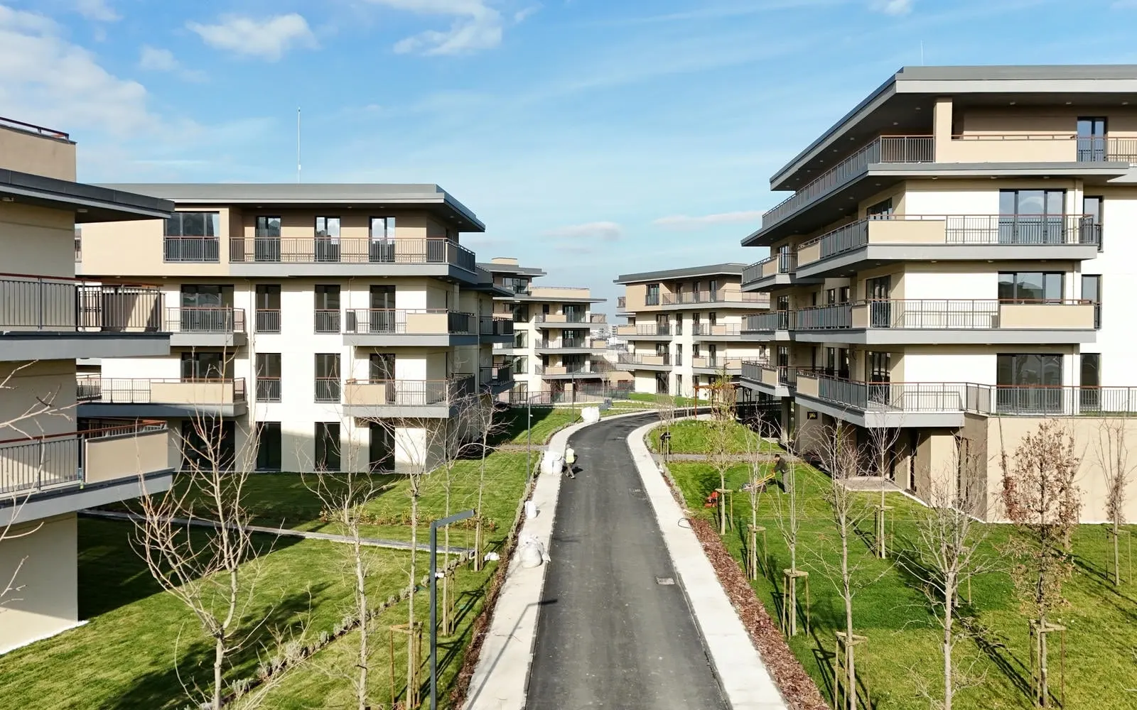 Road and lawns between blocks at Emlak Konut Vadi Evleri 2. Etap