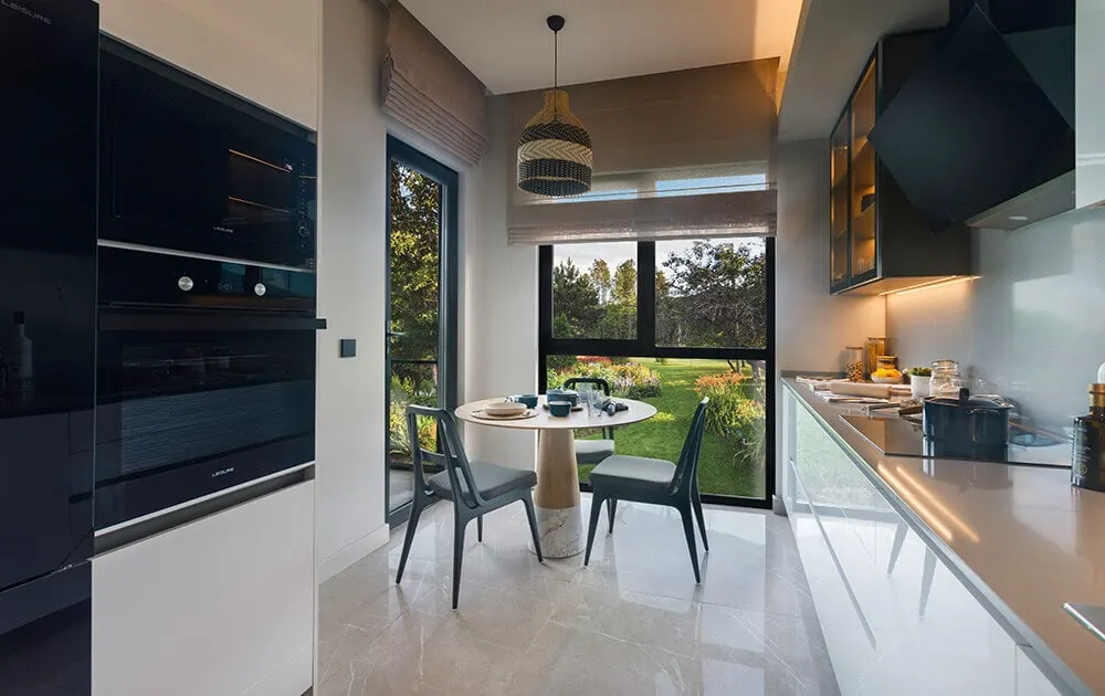 Kitchen with a dining corner in a Limonlu Bahce Konaklari apartment