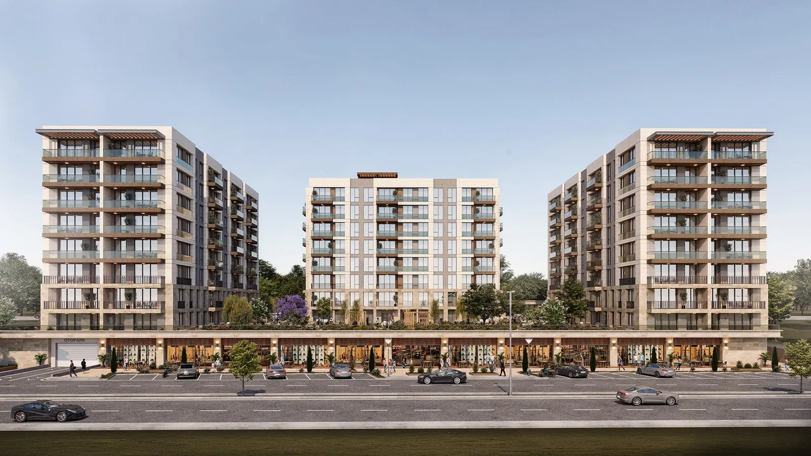 Lotus Gol Evleri blocks seen from the street, with shops on the ground floor