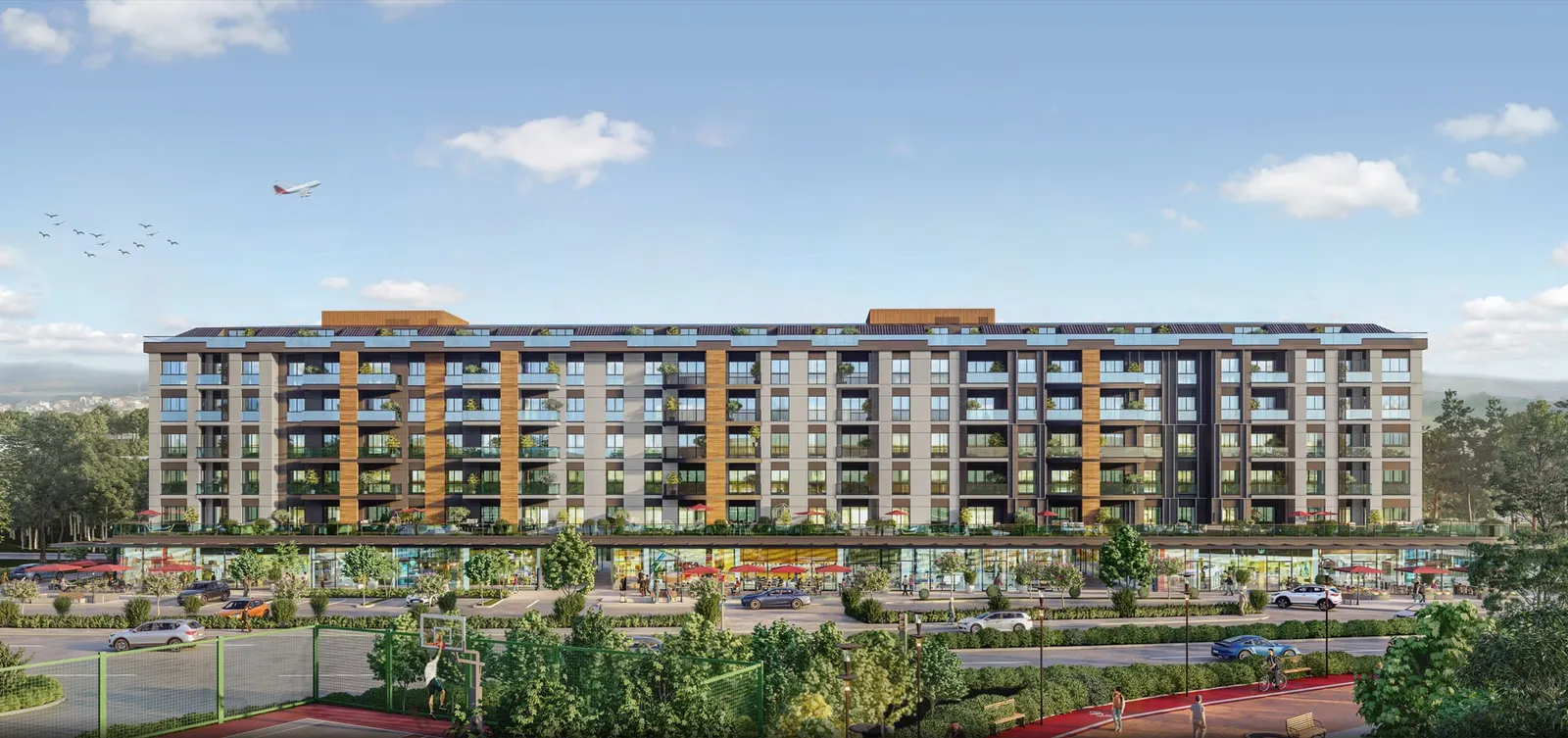 Front view of Luxera Bahce Port with shops at street level