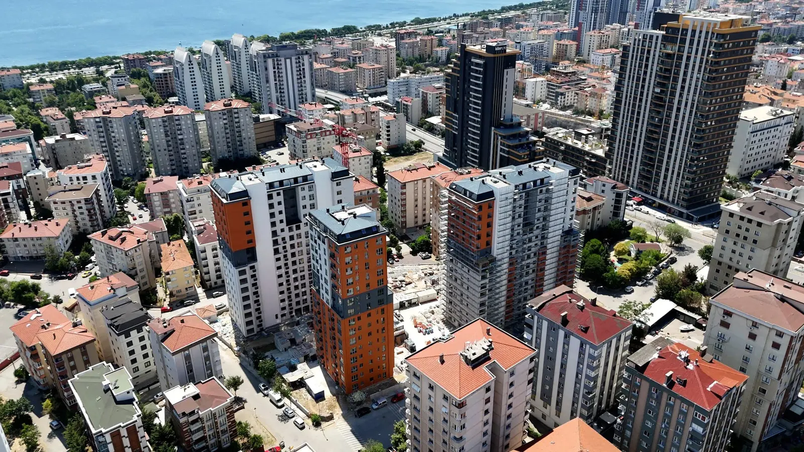 Aerial view of the Tria Green Life blocks in Atalar, with the sea behind