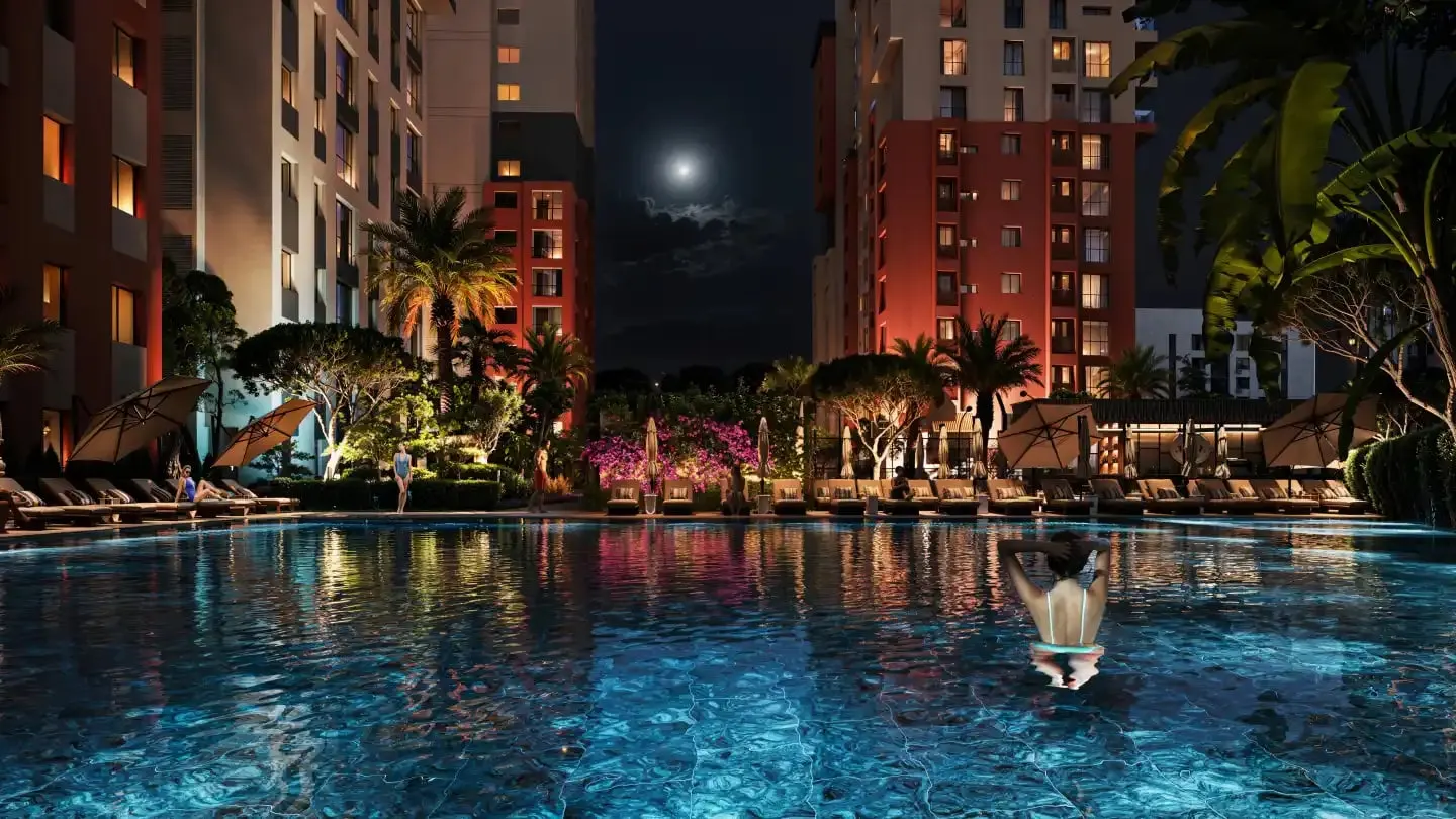Pool and gardens at Tria Green Life in the evening