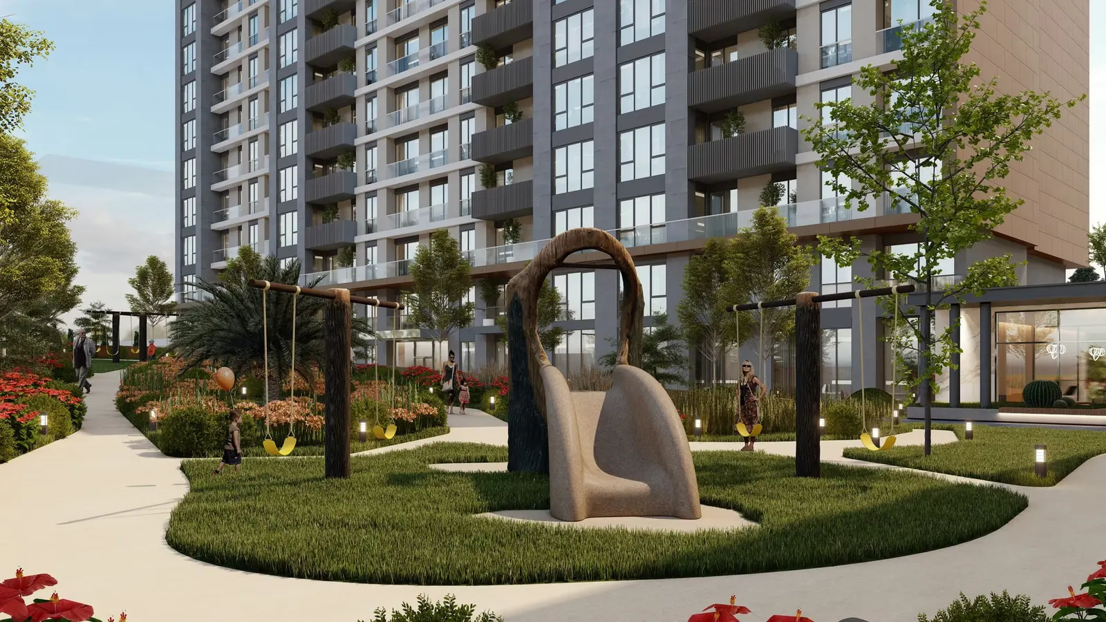 Garden with a sculpture between the Valory Gunesli blocks